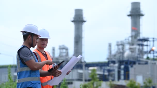 Two Engineers Working Power Plant Work Together Happily Help Each — Stock Video