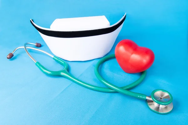 Stethoscope and nurse hat — Stock Photo, Image