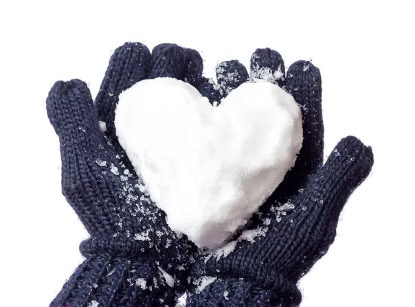 Дамские перчатки и снежное сердце Стоковая Картинка