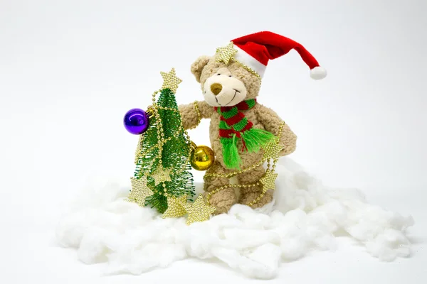 Bear dresses up Christmas tree. number 5 — Stock Photo, Image