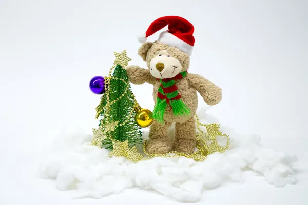 Bear dresses up Christmas tree. number 6 — Stock Photo, Image