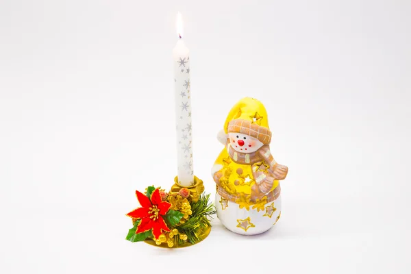 Vela boneco de neve acesa ano novo — Fotografia de Stock