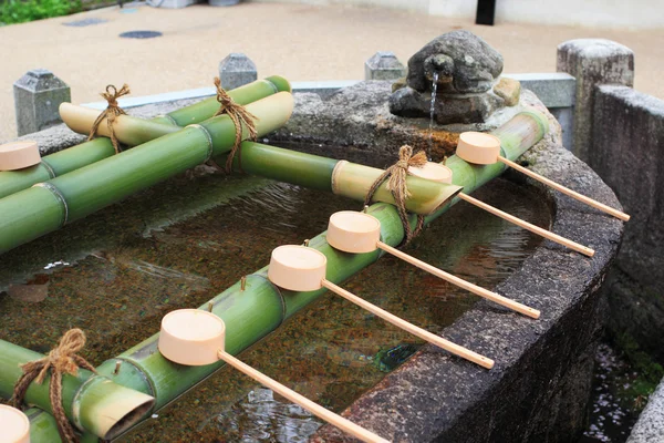 A water well with prayers on bamboo at Hesedera temple — Stock Photo, Image