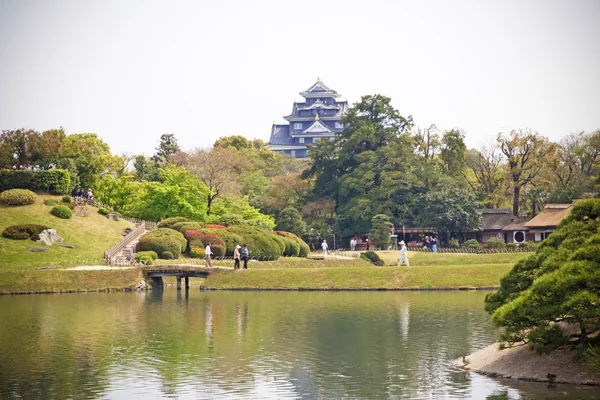 Travelers are visiting in Koraku-en in Okayama, Japan  on April 17, 2014. One of the Three Great Gardens of Japan garden. — Stock Photo, Image