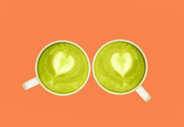Pair Matcha Green Tea Heart Shaped Latte Art Isolated Orange — 图库照片