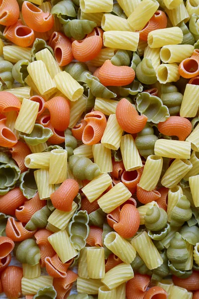Top View Amazing Various Shapes Three Color Uncooked Vegeroni Pasta — Stockfoto