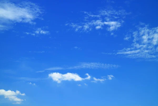 White Clouds Scattered on Vibrant Blue Sunny Sky