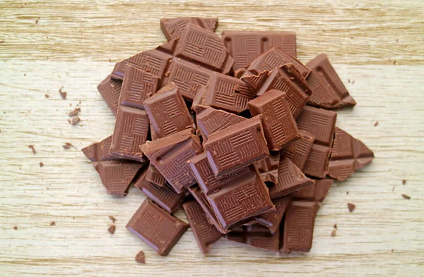 Top View Chocolate Chunks Pile Wooden Backdrop — Stock Photo, Image