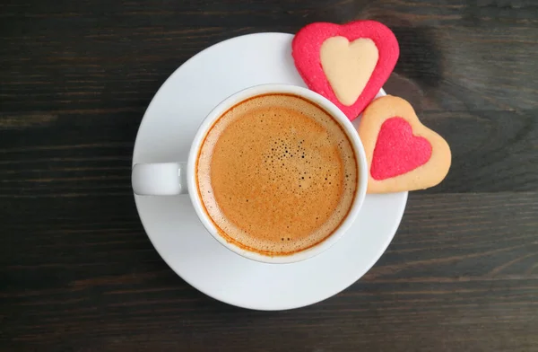 Top View Frothy Espresso Coffee Pair Heart Shaped Cookies Black — стоковое фото