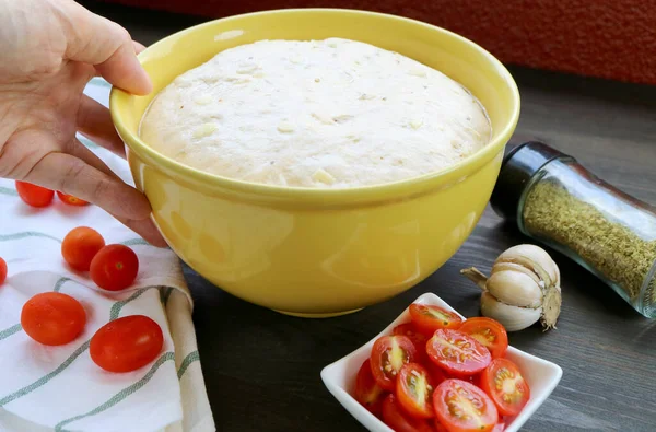 Hand Placing Bowl Proofed Dough Table Other Ingredients — стоковое фото