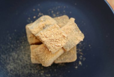 Top View of Delectable Japanese Traditional Confection Called Warabimochi Covered with Kinako Flour