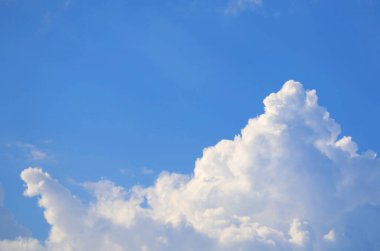 White Cumulus Clouds Floating on Vibrant Blue Sky