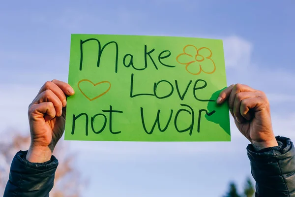 Hands Holding Poster Make Love War — Stock Photo, Image