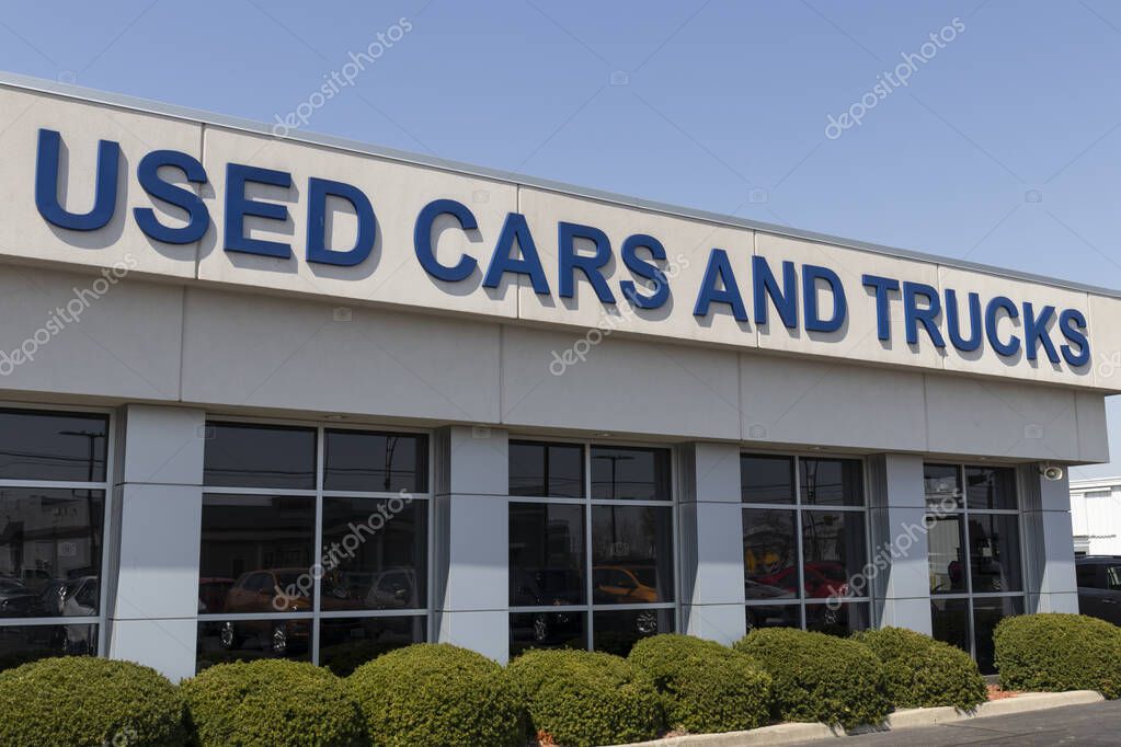 Used Car and Trucks sign at a used car dealership.
