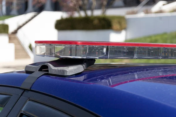 Police light bar, roof mounted red lights. For use in traffic stops and emergencies.