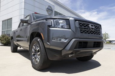 Fishers - Circa May 2022: Nissan Frontier pickup truck display. Nissan offers the Frontier in King and Crew cab models.