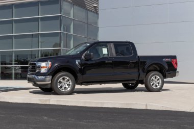 Kokomo - Circa May 2022: Ford F-150 display at a dealership. The Ford F150 is available in XL, XLT, Lariat, King Ranch, Platinum, and Limited models.