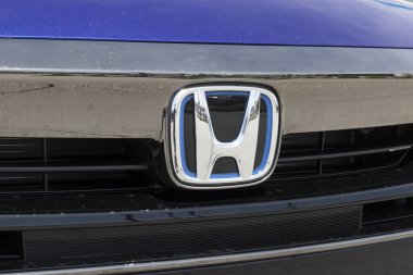 Kokomo - Circa May 2022: Honda logo with the blue trim of a hybrid model. Honda models are always one of the top 25 cars sold in the US every year.