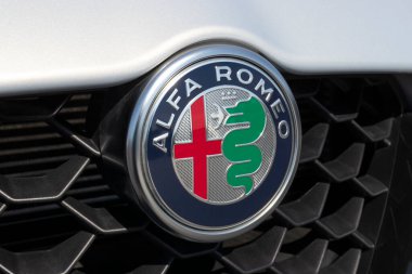 Kokomo - Circa May 2022: Alfa Romeo Giulia display at a Stellantis dealership. The logo shows a red cross, and the biscione, a crowned viper swallowing a Moor.