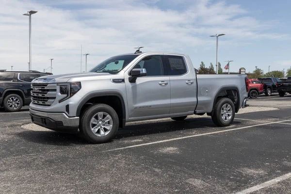 stock image Fishers - Circa May 2022: GMC Sierra pickup display at a dealership. GMC offers the Sierra in HD, HD Pro, AT4 and Denali models.