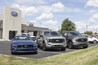 Zionsville - Circa July 2022: Ford Car, SUV and Pickup Truck dealership. Ford manufactures the F-150 and F-Series trucks, Mustang Mach-E and Escape.