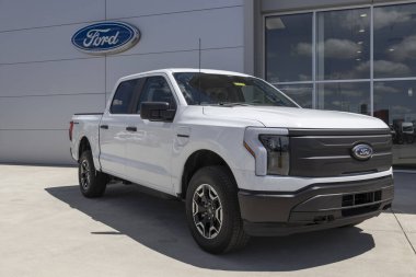 Indianapolis - Circa July 2022: Ford F-150 Lightning display. Ford offers the F150 Lightning all-electric truck in Pro, XLT, Lariat, and Platinum models.