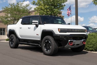 Carmel - Circa July 2022: GMC Hummer EV Sport Utility Truck display. The GMC Hummer EV is offered in EV2, EV2x, and EV3x models. 