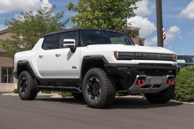 Carmel - Circa July 2022: GMC Hummer EV Sport Utility Truck display. The GMC Hummer EV is offered in EV2, EV2x, and EV3x models. 