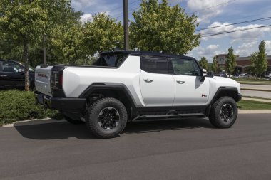 Carmel - Circa July 2022: GMC Hummer EV Sport Utility Truck display. The GMC Hummer EV is offered in EV2, EV2x, and EV3x models. 