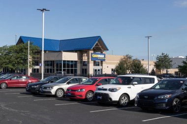 Merrillville - Circa July 2022: CarMax Auto Dealership. CarMax is the largest used and pre-owned car retailer in the US. clipart