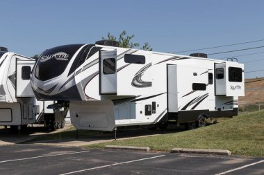 Cincinnati - Circa July 2022: Solitude Grand Design by Winnebago fifth wheel travel trailer RV. Winnebago is a manufacturer of RV and motorhome vacation vehicles. clipart