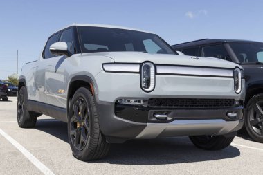 Indianapolis - Circa August 2022: Rivian R1T Pickup Truck display at a dealership. Rivian offers the R1T in Explore, Adventure and Launch models.