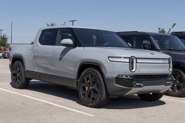 Indianapolis - Circa August 2022: Rivian R1T Pickup Truck display at a dealership. Rivian offers the R1T in Explore, Adventure and Launch models.