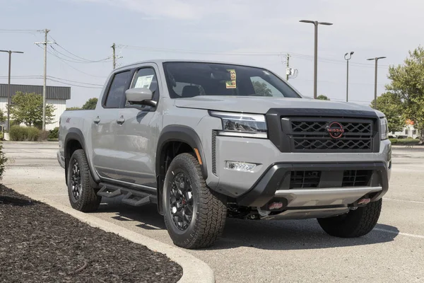 stock image Fishers - Circa September 2022: Nissan Frontier pickup truck display. Nissan offers the Frontier in King and Crew cab models.