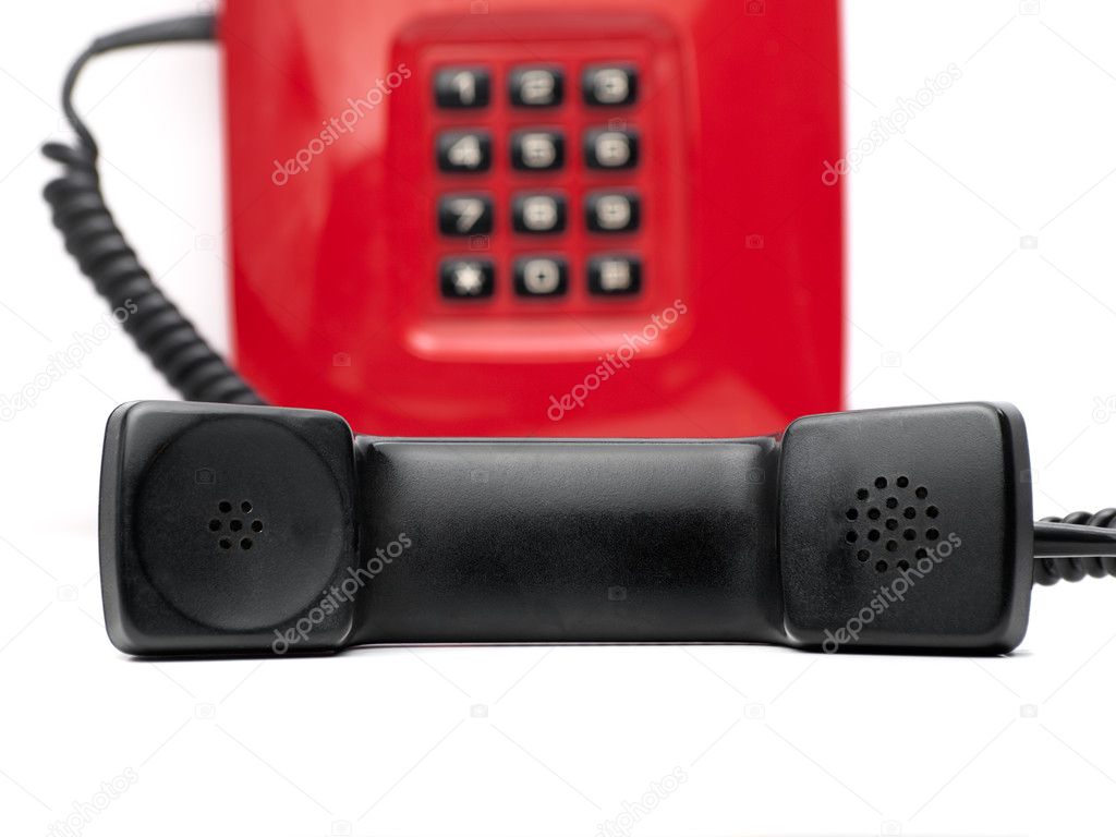 Red telephone over white