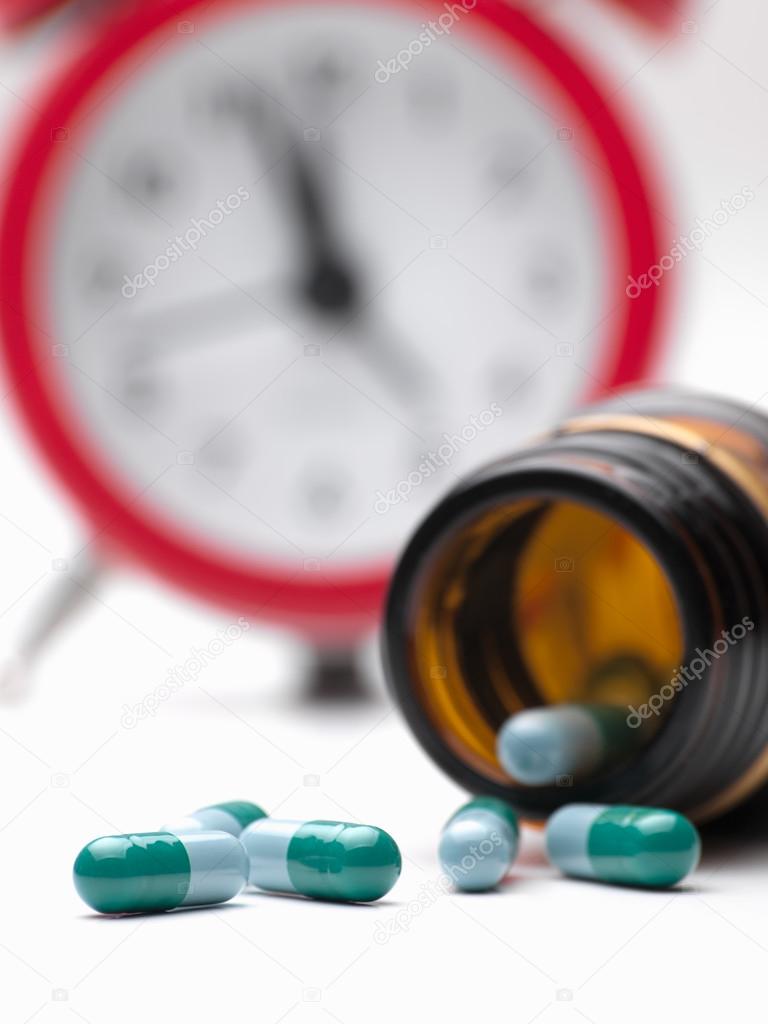 Pills and clock