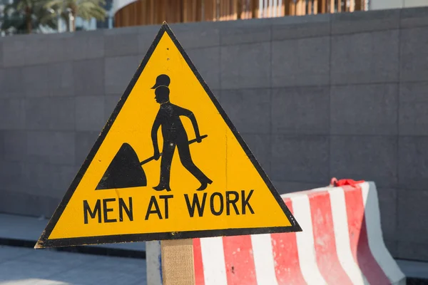 Män vid arbete tecken — Stockfoto