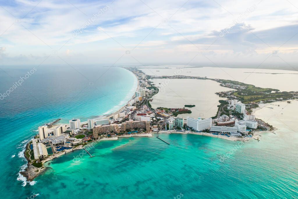 Aerial panoramic view of Cancun beach and city hotel zone in Mexico. Caribbean coast landscape of Mexican resort with beach Playa Caracol and Kukulcan road. Riviera Maya in Quintana roo region on