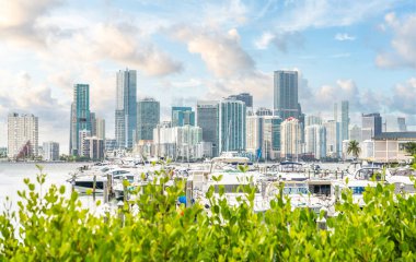 Miami Downtown skyline in daytime with Biscayne Bay and yachts