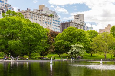 Miniature remote-controlled sailboat in Conservatory Water pond in the Central Park, New York