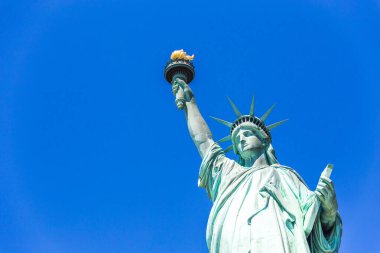Statue of Liberty in New York City, USA with blue sky