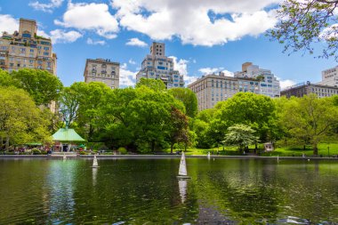 Miniature remote-controlled sailboat in Conservatory Water pond in the Central Park, New York