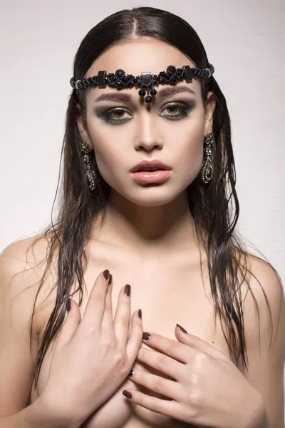 Sexy girl with dark hair with jewellery — Stock Photo, Image
