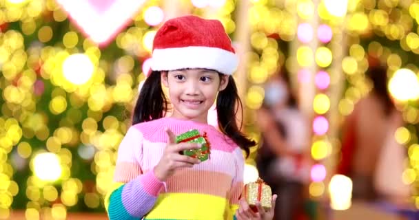 New Year Anticipation Cute Little Girl Wearing Red Christmas Hat — Stock Video