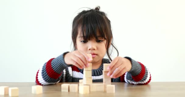 Little Girl Playing Wooden Building Blocks Jenga Having Fun Learning — Stock Video