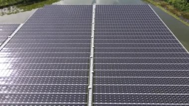 Aerial top view of solar panels or solar cells on buoy floating. Power plant with water, renewable energy source. Eco technology for electric power in industry. Alternative renewable energy.