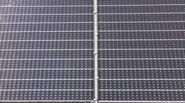 Aerial top view of solar panels or solar cells on buoy floating. Power plant with water, renewable energy source. Eco technology for electric power in industry. Alternative renewable energy.