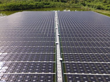 Aerial top view of solar panels or solar cells on buoy floating. Power plant with water, renewable energy source. Eco technology for electric power in industry. Alternative renewable energy.