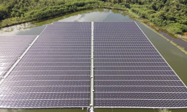 Aerial top view of solar panels or solar cells on buoy floating. Power plant with water, renewable energy source. Eco technology for electric power in industry. Alternative renewable energy.