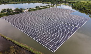 Aerial top view of solar panels or solar cells on buoy floating. Power plant with water, renewable energy source. Eco technology for electric power in industry. Alternative renewable energy.